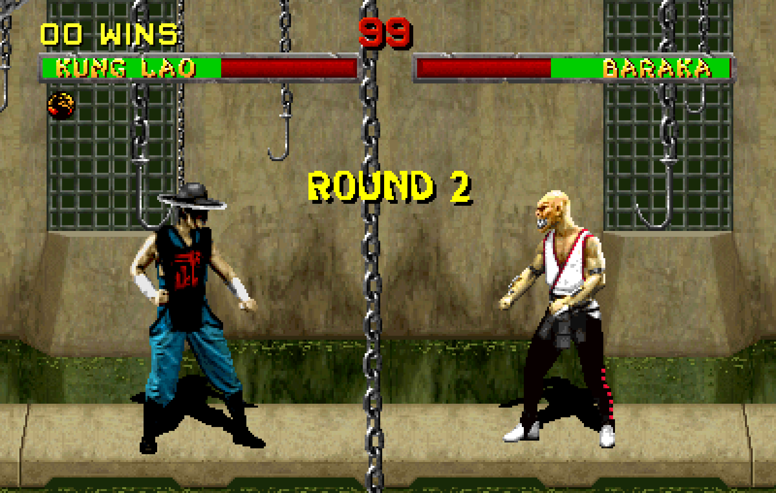 Pixelated fighting game screen showing Kung Lao and Baraka facing off in round 2 with health bars and hanging chains in background.