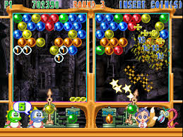 Split-screen bubble shooter game with colorful bubbles, player scores, and animated characters at the bottom.
